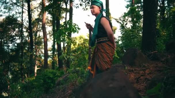 Man Green Clothes Stick Walking Forest While Visiting Someone Village — Stockvideo