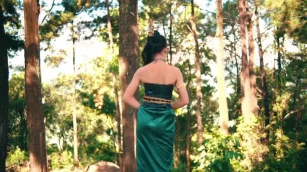 Asian Woman Tossing Her Long Black Hair While Standing Forest — Wideo stockowe