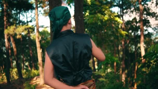 Indonesian Man Exploring Jungle Green Dress While Holding Stick Lonely — Vídeo de Stock