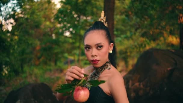 Asian Woman Holding Her Fruit Angry Expression While Wearing Green — Stockvideo