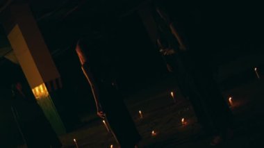 a group of satanic women perform a spirit summoning ritual in the middle of a satanic altar at night