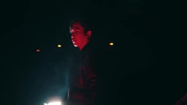 expressions of Satanists performing rituals in black clothes in the dark at night