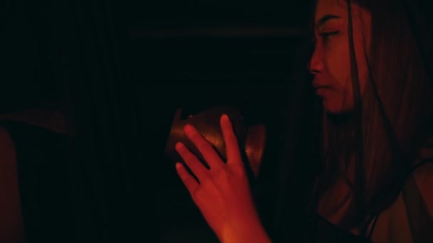 Woman Lifts Jug Gently Her Hands Nighttime Ritual — стоковое видео