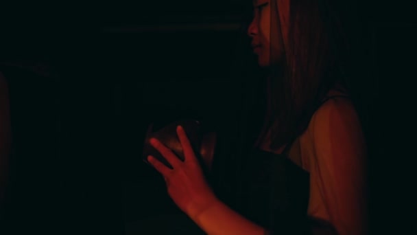 Woman Lifts Jug Gently Her Hands Nighttime Ritual — Stock video