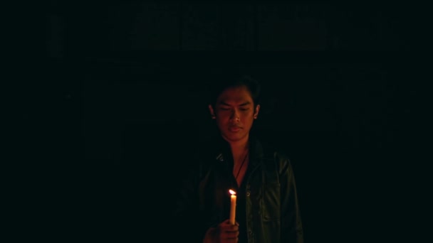 Satanic Man Holding Lit Candle While Performing Ritual Dark Night — Vídeo de Stock