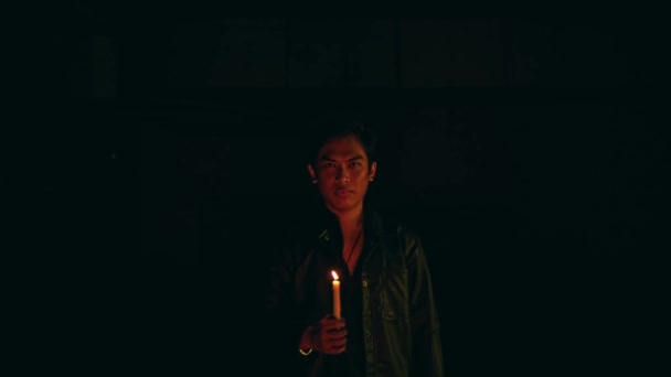 Satanic Man Holding Lit Candle While Performing Ritual Dark Night — Wideo stockowe