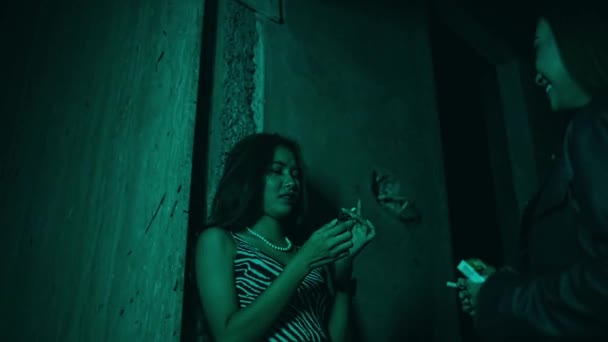 Two Asian Women Smoking Nightclub Sexy Clothes Sparkling Lights Night — Vídeos de Stock
