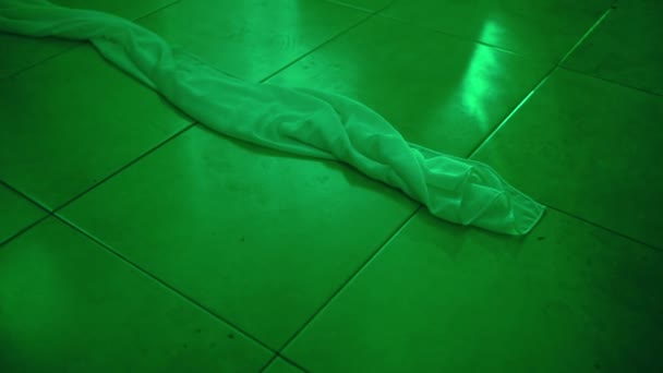White Cloth Lying Floor Green Room — стоковое видео