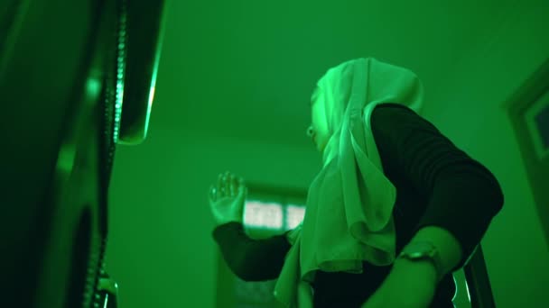 Muslim Woman Dances Passionately Alone Her Green Room — Stock videók