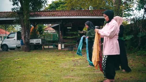 Group Muslim Women Ties Patterned Cloth Waist Doing Dance Practice — стоковое видео