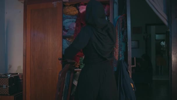 Muslim Woman Cleaning Dirty Clothes Were Scattered Bed Her Room — Vídeo de Stock