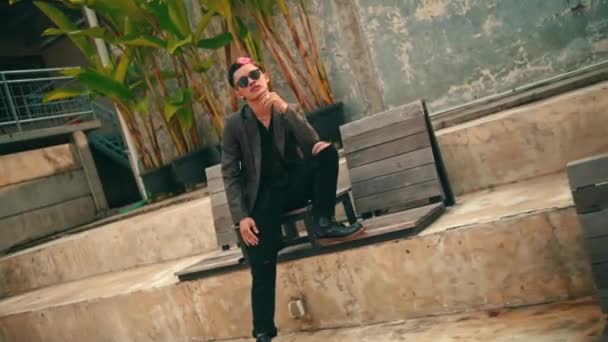 Asian Man Blazer Jacket Sunglasses Relaxing Park Morning — Stock Video