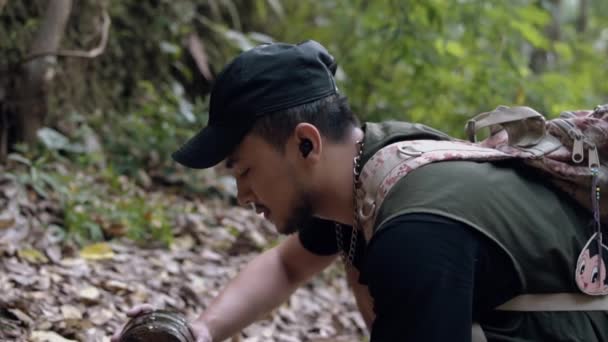 Asian Man Opens Treasure Box Lying Middle Forest Early Morning — Stock Video