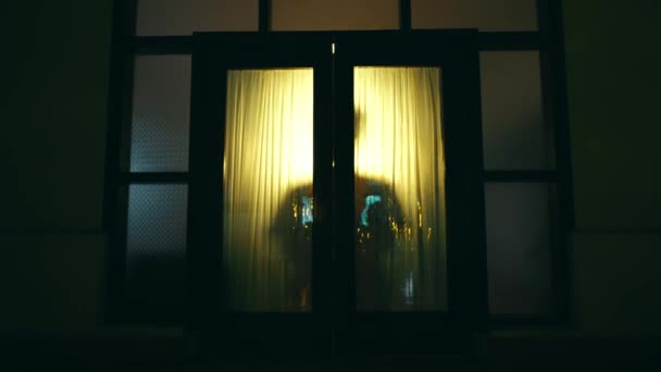 Asian Man Walks Opens Door House Equipped Yellow Lights Night — Stock Video