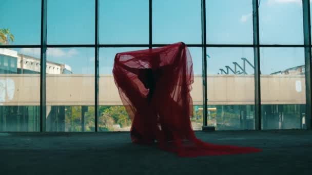 Asian Man Dancing Red Cloth Covering His Body Front Building — Stock Video