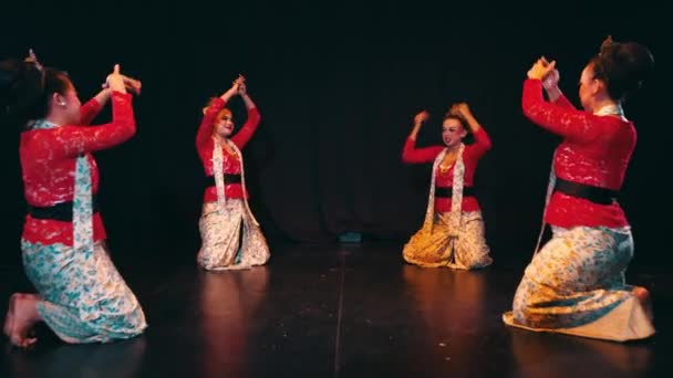 Traditional Dancers Colorful Costumes Performing Stage Expressive Poses Movements Dark — Stock Video