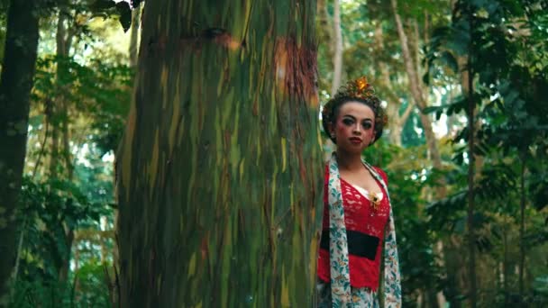 Enigmatic Woman Vibrant Red Dress Crown Posing Lush Green Forest — Stock Video