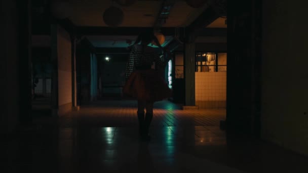 Silhouette Person Walking Dimly Lit Corridor Reflections Floor Creating Mysterious — Stock Video