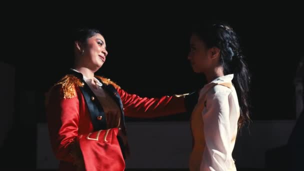 Two Women Theatrical Costumes Stage One Red Jacket Engaging Dramatic — Stock Video