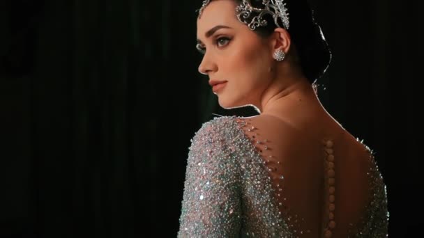 Elegant Woman Sparkling Evening Gown Backless Design Posing Dark Background — Stock Video