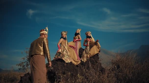 Three People Traditional Attire Riding Camels Scenic Mountain Backdrop Clear — Stock Video
