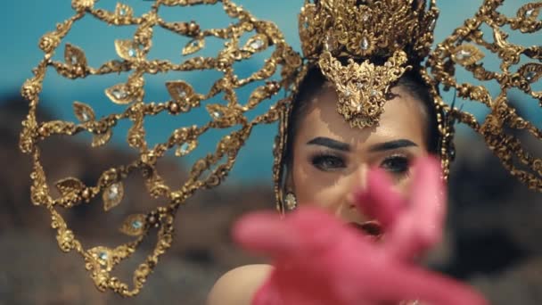 Woman Ornate Golden Headpiece Reaching Out Selective Focus Vibrant Colors — Stock Video