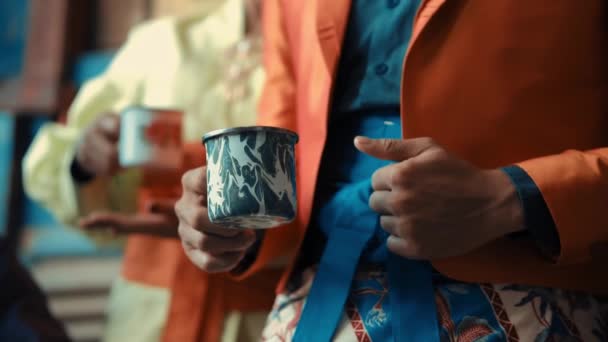 Close Stylish Person Vibrant Suit Holding Marbled Coffee Mug Blurred — Stock Video