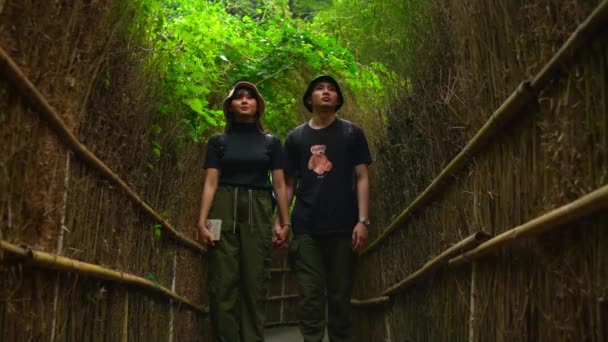 Happy Couple Walking Hand Hand Lush Green Tunnel Foliage Morning — Stock Video