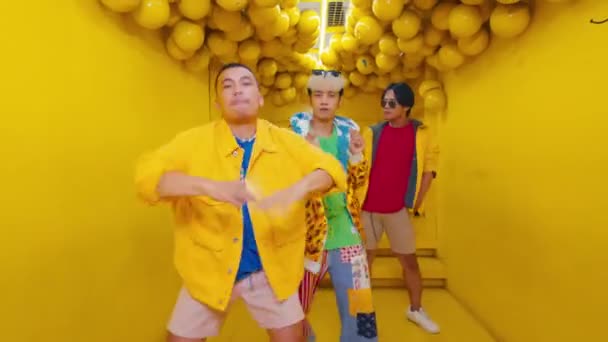 Three Trendy Young Adults Dancing Vibrant Yellow Tunnel Dynamic Poses — Stock Video