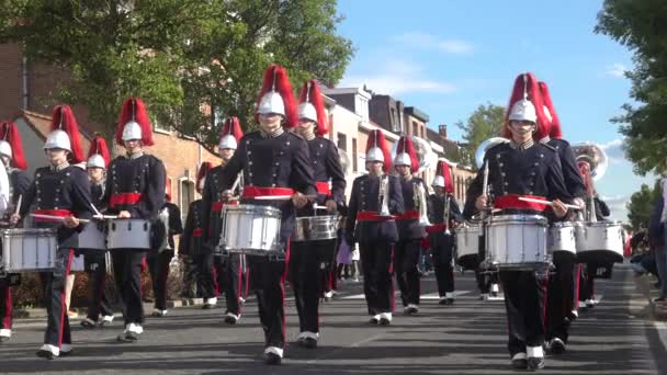 Slow Motion Low Angle Video Marching Band Wearing Red Helmets — Stock Video