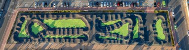 Aerial top-down panorama of the pump track at La Siesta in El Chaparral, Torrevieja, captured in the soft light of early morning clipart