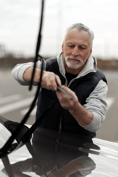 Vertical Lifestyle Portrait Caucasian Senior Man Casual Clothes Checking Replacing — Stock fotografie