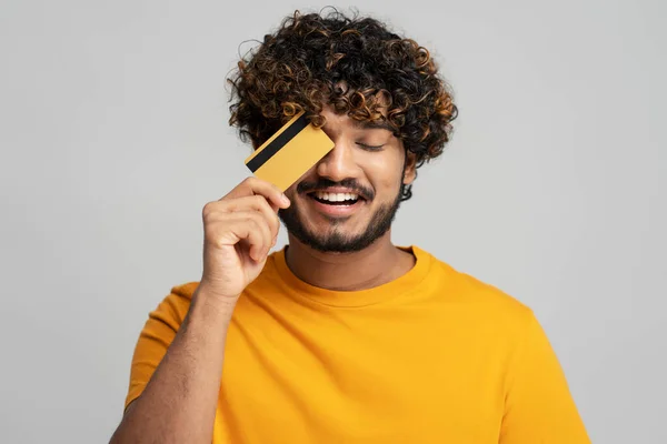 Portrait Smiling Attractive Indian Man Wearing Yellow Shirt Holding Credit — Stock Photo, Image