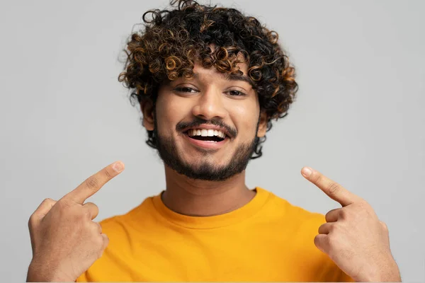 Happy Confident Indian Man Toothy Smile Pointing Fingers His Mouth — Stok fotoğraf
