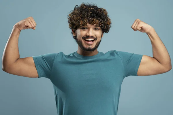 Strong Smiling Indian Man Showing Muscles Biceps Looking Camera Isolated — Stock Photo, Image