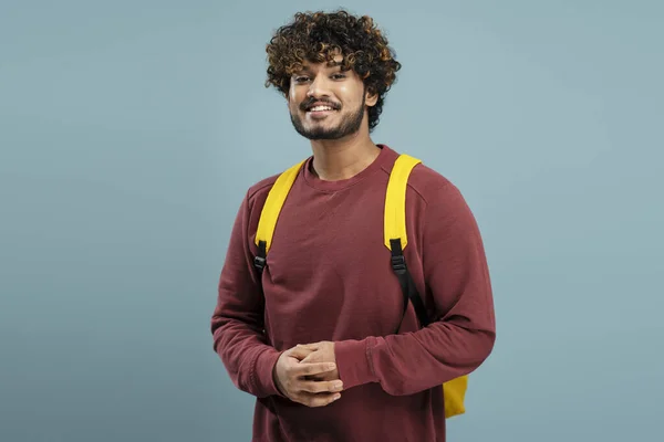 Smart Smiling Indian Student Backpack Looking Camera Isolated Blue Background — Stok fotoğraf