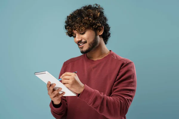 Smiling Indian Man Taking Notes Notepad Isolated Blue Background Smart — Stock Photo, Image