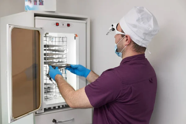 Rear View Dental Practitioner Doctor Dentist Hygienist Opening Autoclave Sterilizer — Stock Photo, Image
