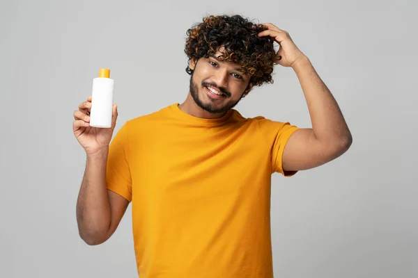 Smiling Attractive Indian Man Holding White Bottle Moisturizing Nourishing Dandruff — Stock Photo, Image