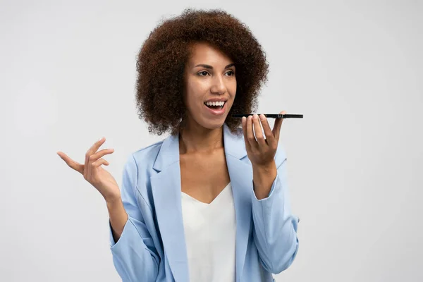 Charming African American Businesswoman Using Voice Recognition Function Cell Phone — Stockfoto