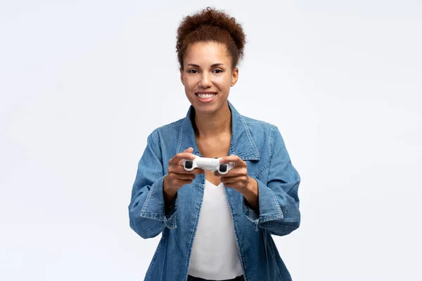 African American Gamer Woman Playing Video Game Using Joystick Isolated — стоковое фото
