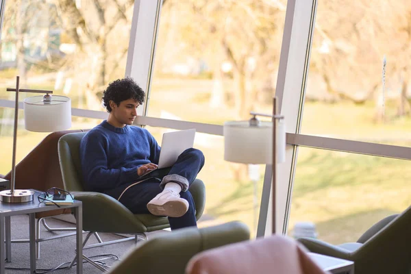 Thoughtful Hispanic Guy University Graduated Student Using Laptop Watching Webinar — Stock Photo, Image