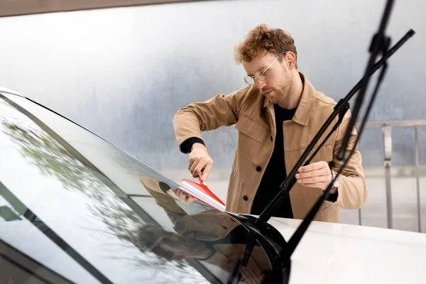 Serious Man Removing Remaining Water Windshield Window Scraper Concept Self — Stock Photo, Image