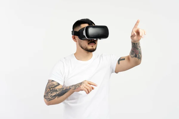 stock image Handsome Asian man playing video game using VR glasses isolated on white background. Attractive young male with digital 3d technology
