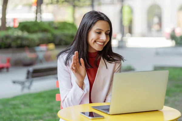 Smiling Indian Woman Greeting Laptop Computer Video Call Sitting Workplace — Stock Photo, Image