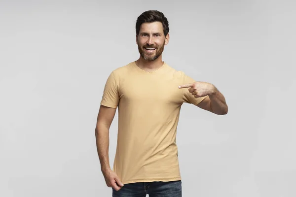 Portrait Smiling Handsome Bearded Man Hipster Wearing Blank Shirt Pointing — Stock Photo, Image