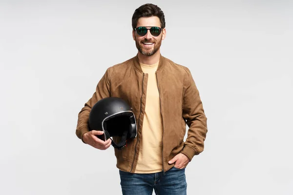 Handsome Smiling Bearded Man Biker Holding Motorcycle Helmet Isolated Gray — Stock Photo, Image