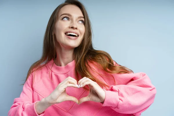 Portrait Attractive Smiling Woman Wearing Pink Sweatshirt Toothy Smile Gesturing — Stock Photo, Image