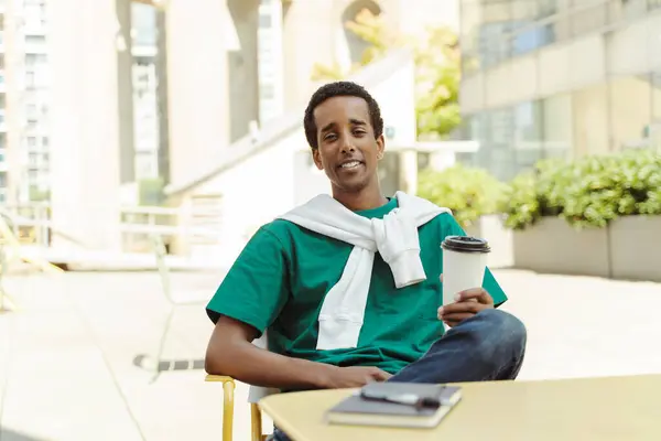 Portrait Smiling Positive African American Man Sitting Cafe Holding Coffee — Stock Photo, Image