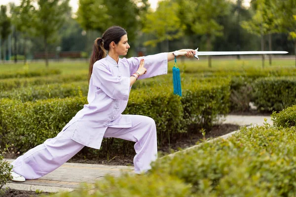 Caucasian Woman Working Out Tai Chi Sword Morning Park Chinese — Stock Photo, Image